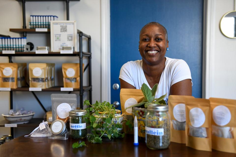 Joni Gude, owner of Baldflower Apothecary, stands for a photo nside her apothecary in Spartanburg, S.C., on Tuesday, March 12, 2024.