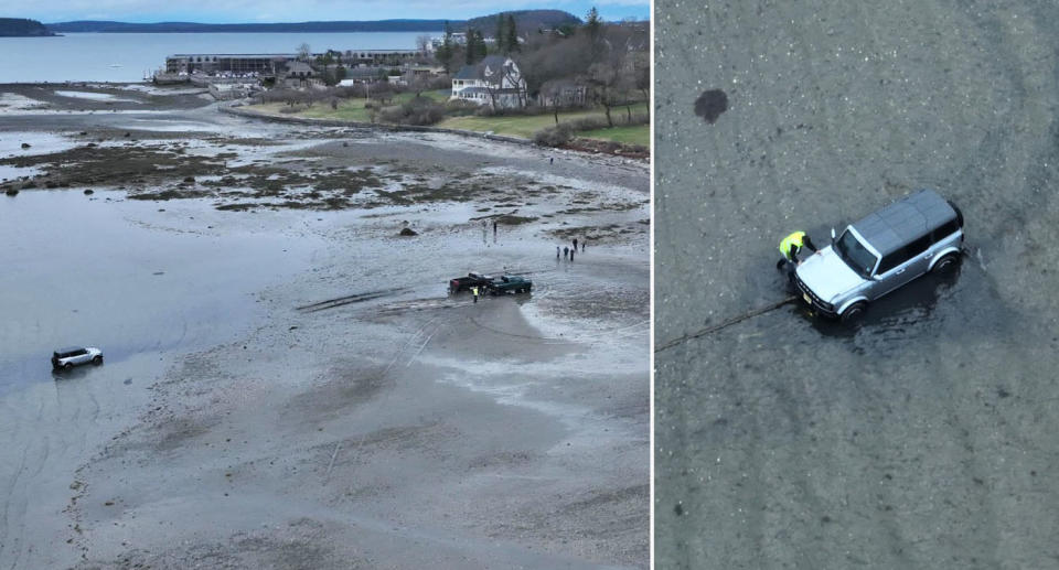 car being towed on beach by two trucks