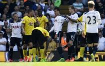 Britain Football Soccer - Tottenham Hotspur v Watford - Premier League - White Hart Lane - 8/4/17 Tottenham's Dele Alli is held back by Eric Doer after being fouled by Watford's Jose Holebas Reuters / Dylan Martinez Livepic