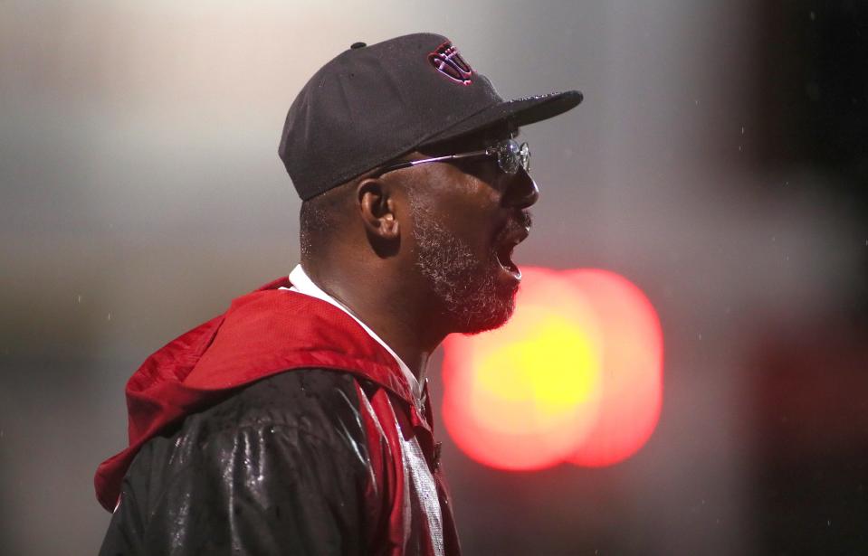 Aliquippa Head Coach Mike Warfield calls out to his players during the second half of the WPIAL 4A playoff game against Montour Friday night at Jimbo Covert Field in Freedom, PA.