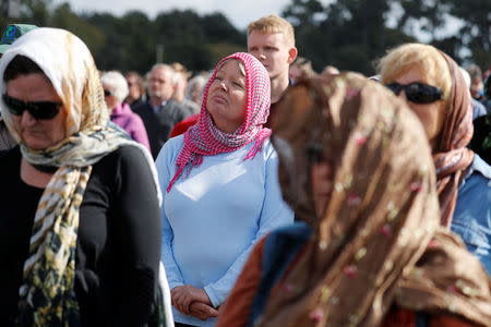 People attend the national remembrance service for victims of the mosque attacks, at Hagley Park in Christchurch, New Zealand March 29, 2019. REUTERS/Jorge Silva