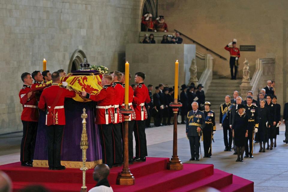 A general view as King Charles III, Princess Anne, Princess Royal and Camilla, Queen Consort view the coffin carrying Queen Elizabeth II being laid to rest in Westminster Hall