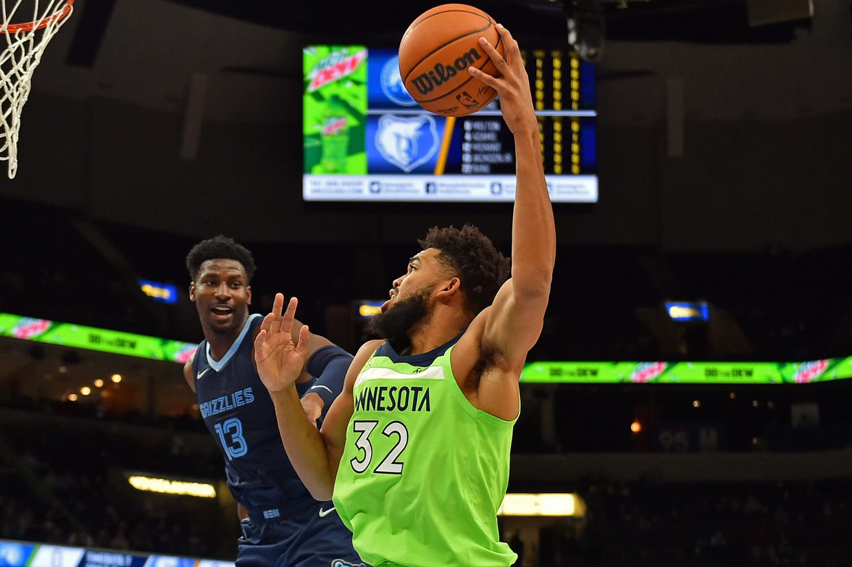 Karl-Anthony Towns of the Minnesota Timberwolves hit a crazy 3 to send Monday night's game to overtime. (Photo by Justin Ford/Getty Images)