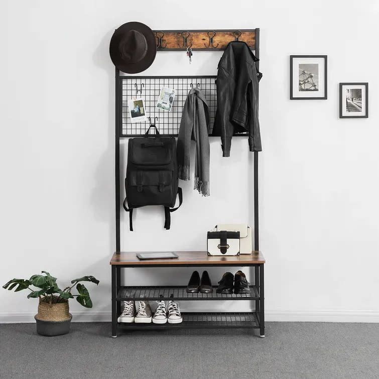 <h2>17 Stories Lakya 36.2" Wide Hall Tree with Bench & Shoe Storage</h2><br><strong>When "coat closets" are a foreign concept:</strong> Turn to a compact, free-standing entryway rack to hold your coats, bags, and shoes in maximized space-saving fashion.<br><br><em>Shop <strong><a href="https://www.wayfair.com/furniture/pdp/17-stories-lakya-hall-tree-with-bench-and-shoe-storage-w006882250.html" rel="nofollow noopener" target="_blank" data-ylk="slk:Wayfair" class="link ">Wayfair</a></strong></em><br><br><strong>17 Stories</strong> Lakya 36.2'' Wide Hall Tree with Bench and Shoe Storage, $, available at <a href="https://go.skimresources.com/?id=30283X879131&url=https%3A%2F%2Fwww.wayfair.com%2Ffurniture%2Fpdp%2F17-stories-lakya-hall-tree-with-bench-and-shoe-storage-w006882250.html" rel="nofollow noopener" target="_blank" data-ylk="slk:Wayfair" class="link ">Wayfair</a>