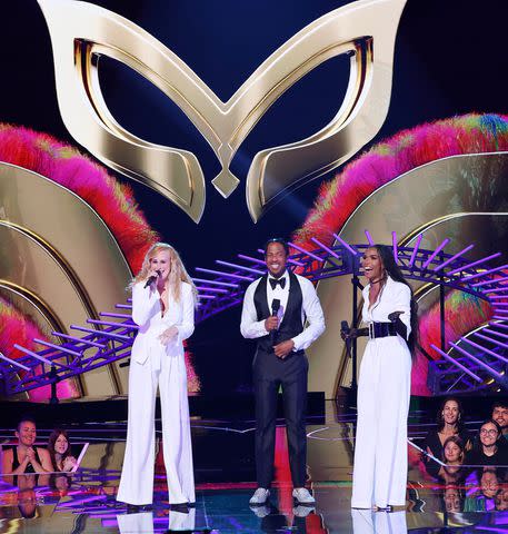<p>Trae Patton/Fox</p> Michelle Williams and Rumor Willis photographed on 'The Masked Singer' stage with host Nick Cannon.