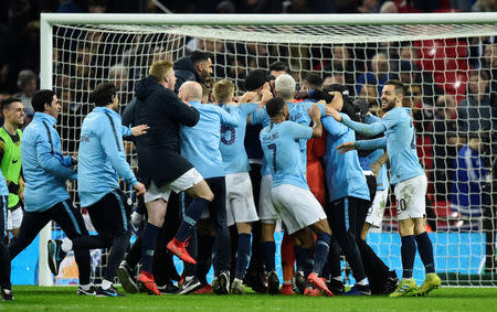 Soccer Football - Carabao Cup Final - Manchester City v Chelsea - Wembley Stadium, London, Britain - February 24, 2019 Manchester City players and staff celebrate after winning the penalty shootout REUTERS/Rebecca Naden