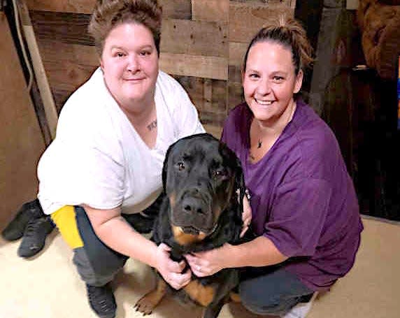 Jessica Cole, right, and Christina Fiske pose with Rottweiler Bruce, who is undergoing treatments for lymphoma with help from the Magic Bullet Fund.