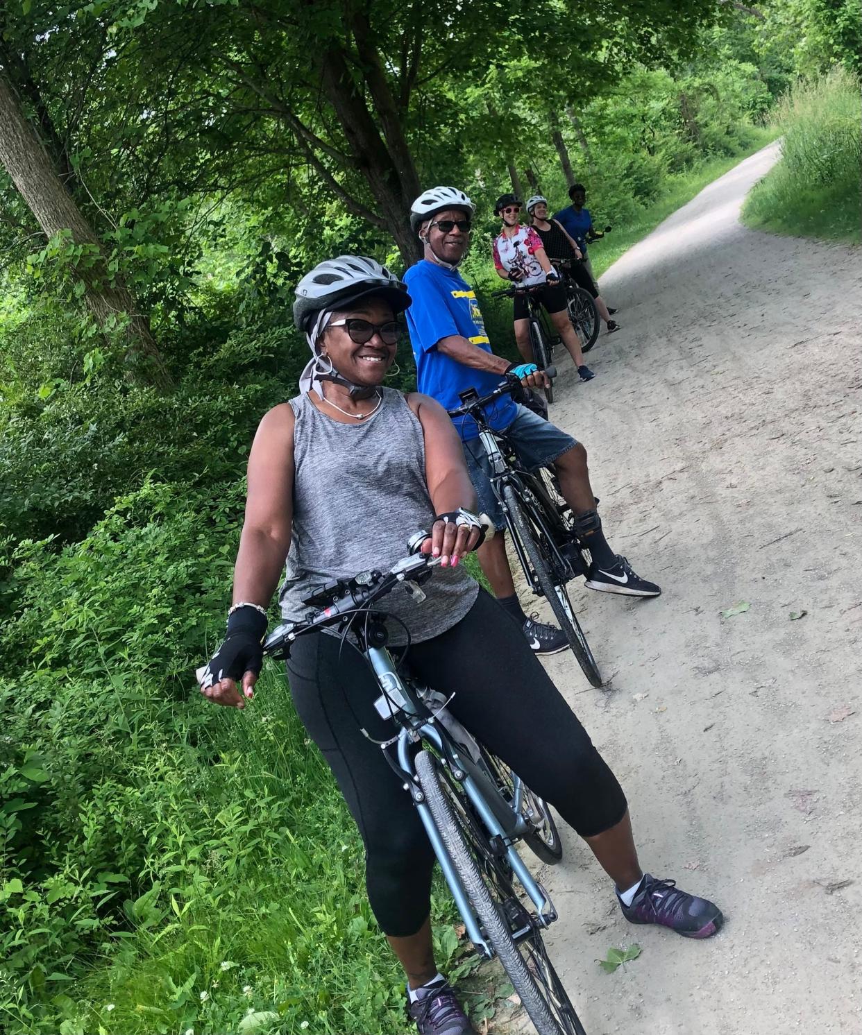 Bicyclists ride along the Towpath Trail, which is part of the Ohio & Erie Canalway.