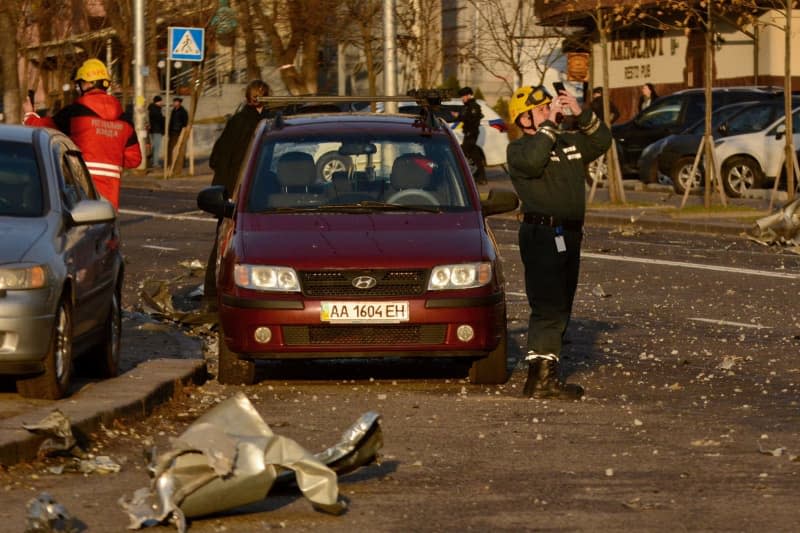 Rescue workers inspect the impact site of a Russian missile. Russia once again massively attacked neighboring Ukraine with drones and cruise missiles during the night and on Friday morning. Aleksandr Gusev/SOPA Images via ZUMA Press Wire/dpa