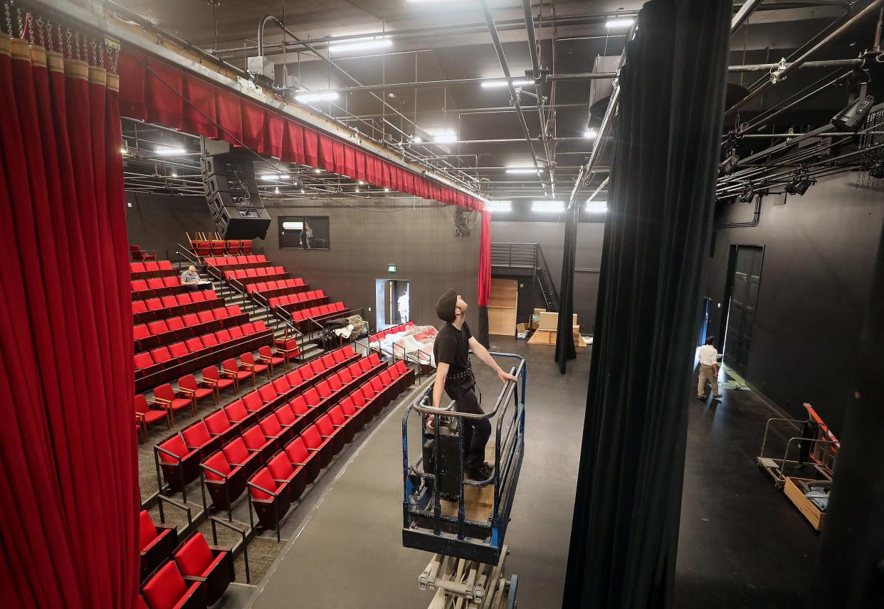 Buxton Center for Bainbridge Performing Arts technical director Ben Mueller moves a lift into position as he and fellow crew members get the stage ready for their upcoming opening, on Tuesday, Sept. 26, 2023.