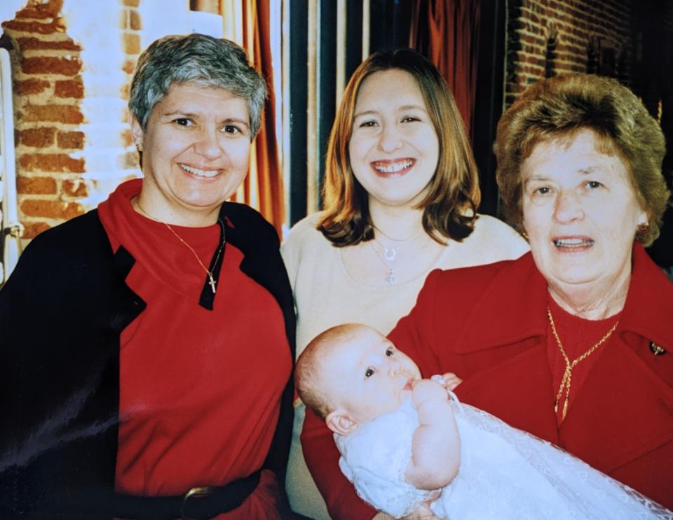 Before Liz realised her grandmother's behaviour was due to dementia, pictured left to right Liz's mum, Liz, and her nanny holding her eldest daughter in 2002. (Supplied)