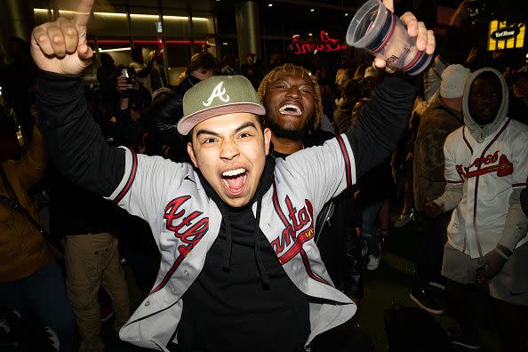 ATLANTA, GA - NOVEMBER 02: Atlanta Braves fans celebrate as they follow Game Six of the World Series against the Houston Astros on November 2, 2021 in Atlanta, Georgia. The Braves defeated the Astros 7-0 to win the World Series for the first time since 1995. (Photo by Megan Varner/Getty Images)