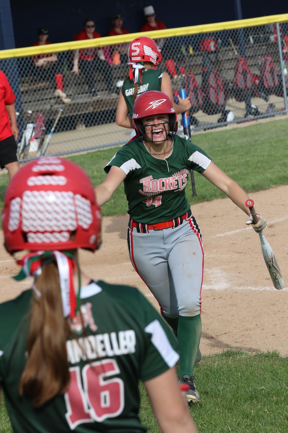 Oak Harbor's Sydney Overmyer celebrates scoring in the sixth inning.