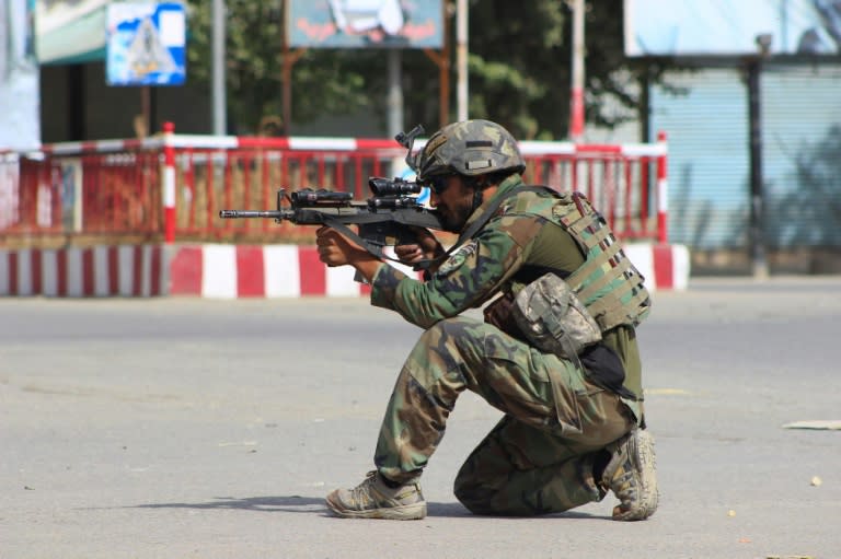 An Afghan National Army commando aims his weapon amid ongoing fighting between Taliban militants and Afghan security forces in Kunduz on October 5, 2016