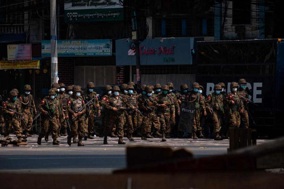 Soldiers in Yangon after clashes with protesters in March 2021.  Source: Getty Images