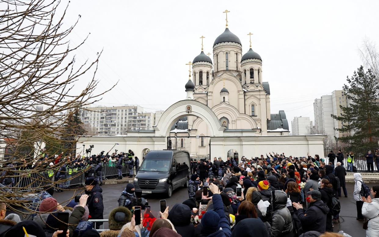 A hearse reportedly carrying the body of Russian opposition politician Alexei Navalny is parked outside the Soothe My Sorrows church