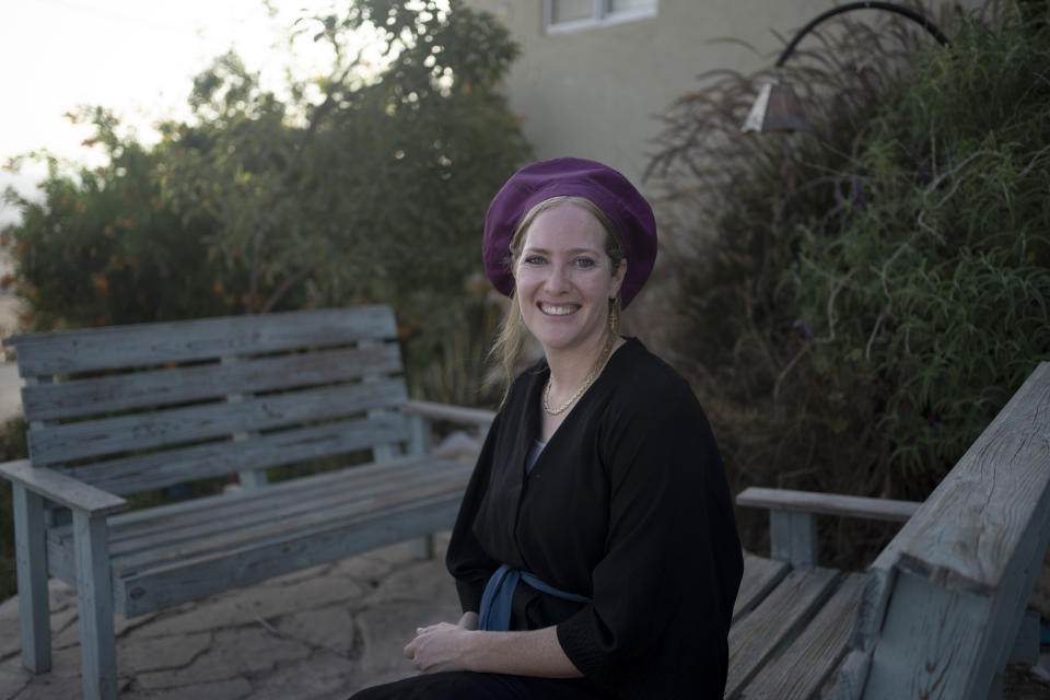 Shulamit Ben Yashar poses for a portrait in the settlement outpost of Asa'el in the south Hebron hills on Monday, Sept. 4, 2023. "We know this is the best government we've ever had," says the 32-year-old who lives among 90 families, including Israel's Minister of Finance Bezalel Smotrich's brother Tuvia — in the community which received legal approval last Wednesday. (AP Photo/Maya Alleruzzo)