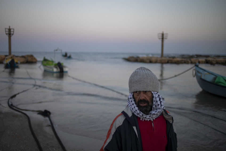 A local fisherman who goes by the name Jumbo returns from a fishing trip on the Mediterranean Sea, in the Israeli Arab village of Jisr al-Zarqa, Israel, in the early morning of Thursday, Feb. 25, 2021. After weathering a year of the coronavirus pandemic, an oil spill in the Mediterranean whose culprits remain at large delivered another blow for the fishermen of Jisr al-Zarqa. (AP Photo/Ariel Schalit)