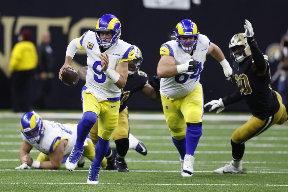 Los Angeles Rams quarterback Matthew Stafford (9) scrambles against the New Orleans Saints in the first half of an NFL football game in New Orleans, Sunday, Nov. 20, 2022. (AP Photo/Butch Dill)