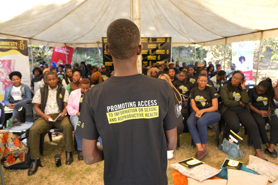 A man is seen during a presentation at a workshop on women's sexual and reproductive health in Harare, Zimbabwe, on Friday, June, 16, 2023. Zimbabwean woman Sitabile Dewa is challenging a sex toys ban in the country which she describes in court papers filed in March as "archaic" and "repressive" laws used to arrest women for having sex toys.Her court challenge - a bold act in a society where females are usually shamed for being openly sexual - highlights the struggles endured by Zimbabwean women battling to attain sexual freedom. (AP Photo/Tsvangirayi Mukwazhi)