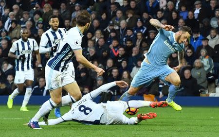 Britain Football Soccer - West Bromwich Albion v Stoke City - Premier League - The Hawthorns - 4/2/17 Stoke City's Marko Arnautovic in action with West Bromwich Albion's Jake Livermore Reuters / Anthony Devlin Livepic