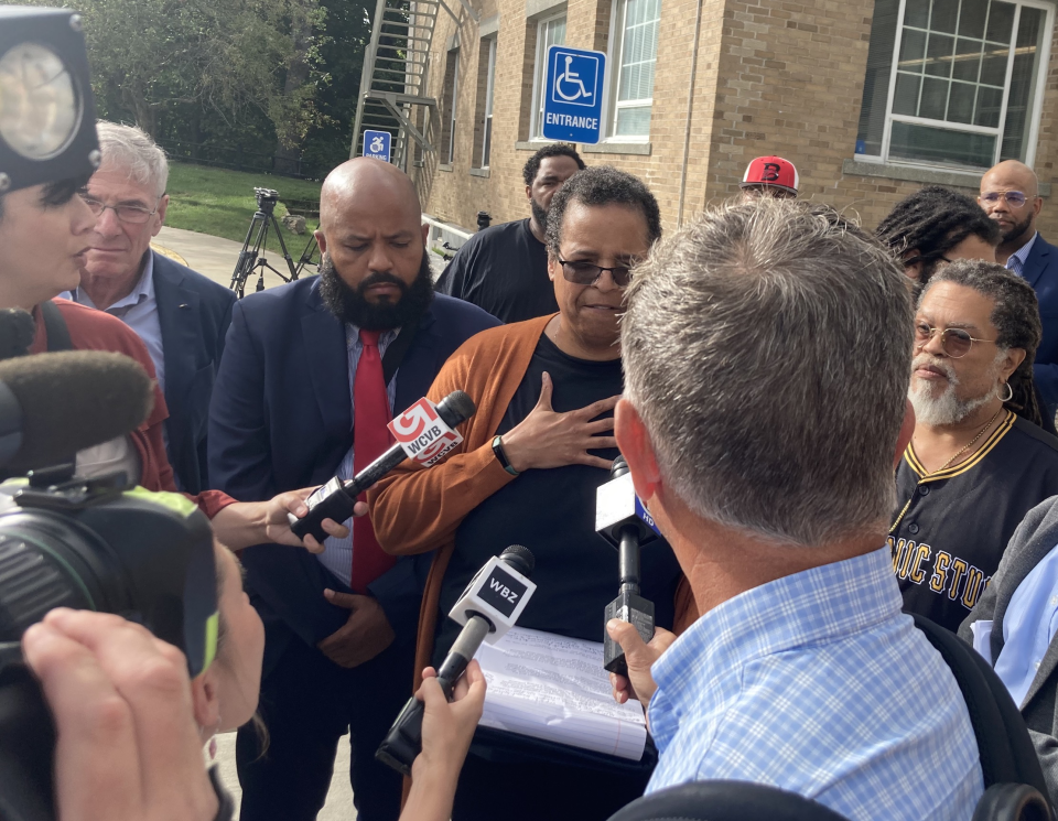 The president of the Cape Cod chapter of the National Association for the Advancement of Colored People, known as the NAACP, Lynne Rhodes, center, talks to media representatives after a judge's decision to release John P. Sheeran to his parents, with conditions.