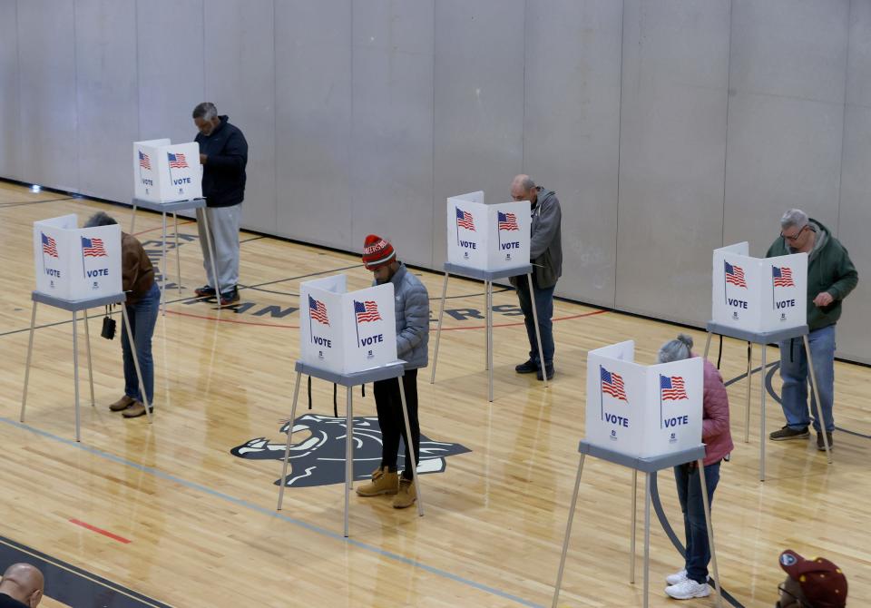 Voters cast their ballots at precincts nine and ten inside the gymnasium at Kennedy Elementary School in Pontiac on Election Day on Tuesday, Nov 8, 2022.