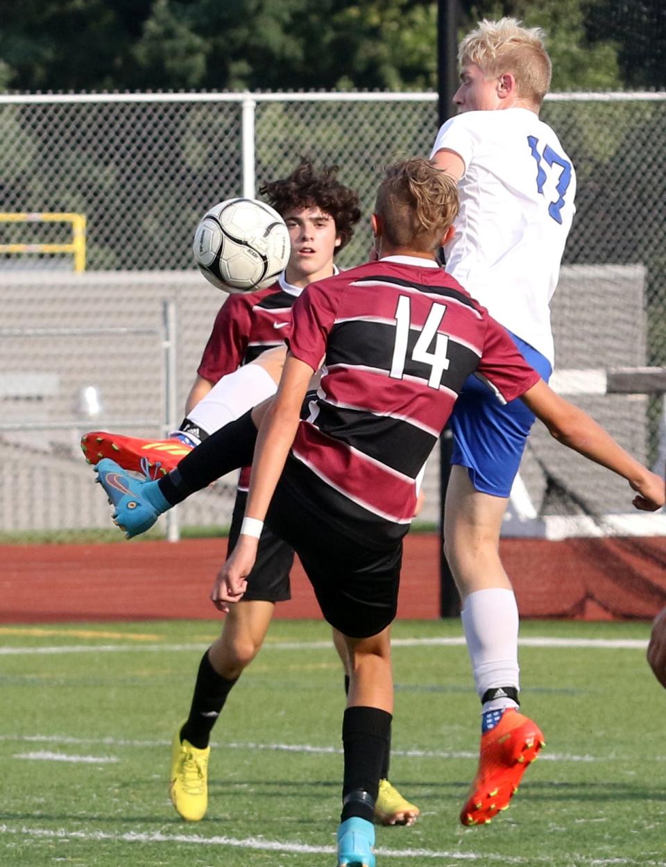 Horseheads' Ben Church (17) goes up for the ball between two Elmira players during the Express' 1-0 win in STAC West boys soccer Sept. 14, 2022 at Ernie Davis Academy's Marty Harrigan Athletic Field.