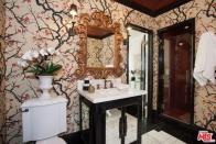 <p>It also has two and a half bathrooms, including this one with an ornate soaker tub and lavish decor. (Realtor.com) </p>