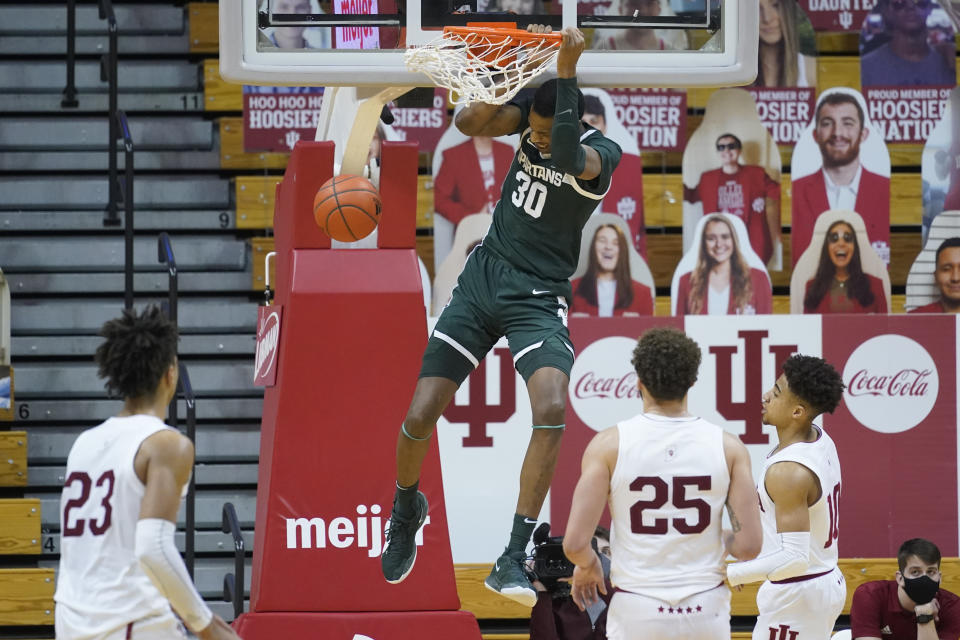 Michigan State's Marcus Bingham Jr. (30) dunks during the second half of an NCAA college basketball game against Indiana, Saturday, Feb. 20, 2021, in Bloomington, Ind. Michigan State won 78-71. (AP Photo/Darron Cummings)