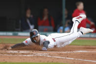 Cleveland Guardians' Andrés Giménez scores on a ball hit by Brayan Rocchio during the third inning of a baseball game against the Chicago White Sox, Monday, April 8, 2024, in Cleveland. (AP Photo/Ron Schwane)