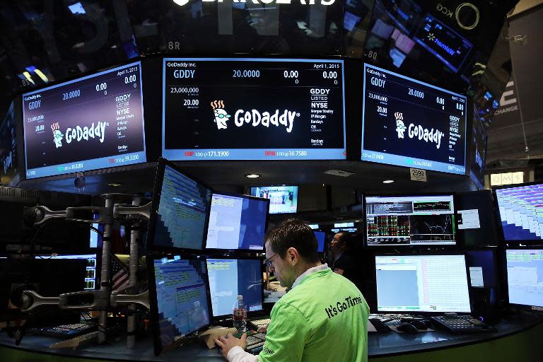 Traders work on the floor of the New York Stock Exchange, on April 1, 2015