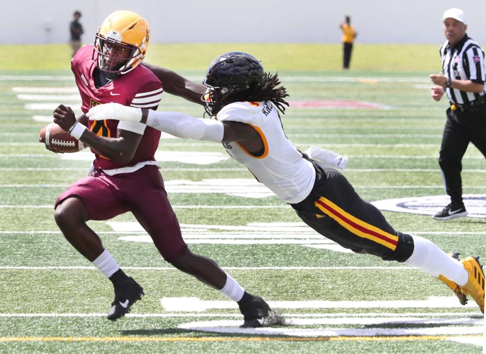 Bethune-Cookman QB Jalon Jones (4) escapes a diving Grambling State tackler Saturday, Sept. 24, 2022 at Daytona Stadium.