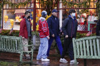 President Joe Biden walks by shops with members of his family including his grandson Hunter Biden in Nantucket, Mass., Friday, Nov. 26, 2021. (AP Photo/Carolyn Kaster)