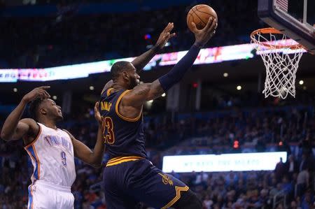 Feb 9, 2017; Oklahoma City, OK, USA; Cleveland Cavaliers forward LeBron James (23) drives to the basket in front of Oklahoma City Thunder forward Jerami Grant (9) during the second quarter at Chesapeake Energy Arena. Mandatory Credit: Mark D. Smith-USA TODAY Sports