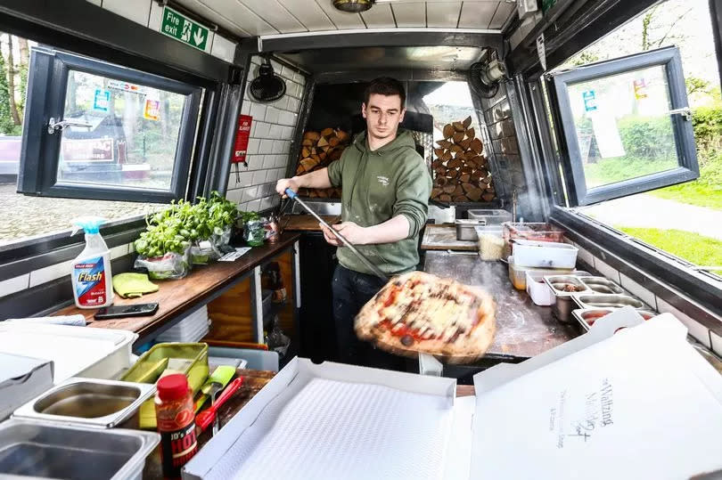 Freshly made pizza is served up from the the Waltzing Matilda narrowboat café on Macclesfield Canal