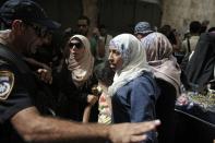 Israeli security forces block a road leading to the annexed east Jerusalem Al-Aqsa mosque compound on August 2, 2015 as Palestinians take part in a protest against the death of the 18-month-old child killed in an arson attack in the West Bank