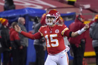 Kansas City Chiefs quarterback Patrick Mahomes celebrates after throwing a 5-yard touchdown pass to tight end Travis Kelce during the second half of the AFC championship NFL football game against the Buffalo Bills, Sunday, Jan. 24, 2021, in Kansas City, Mo. (AP Photo/Jeff Roberson)