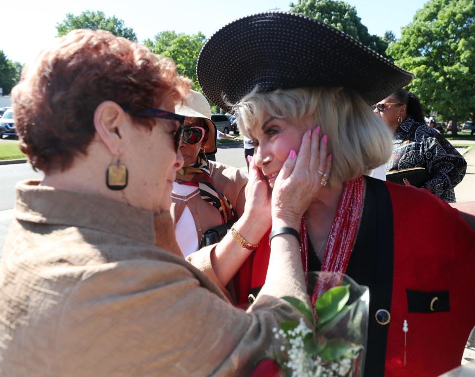 Ilene Shapiro, left, Summit County executive, greets Ophelia Averitt before Saturday's ceremony to rename the road in honor of Averitt.