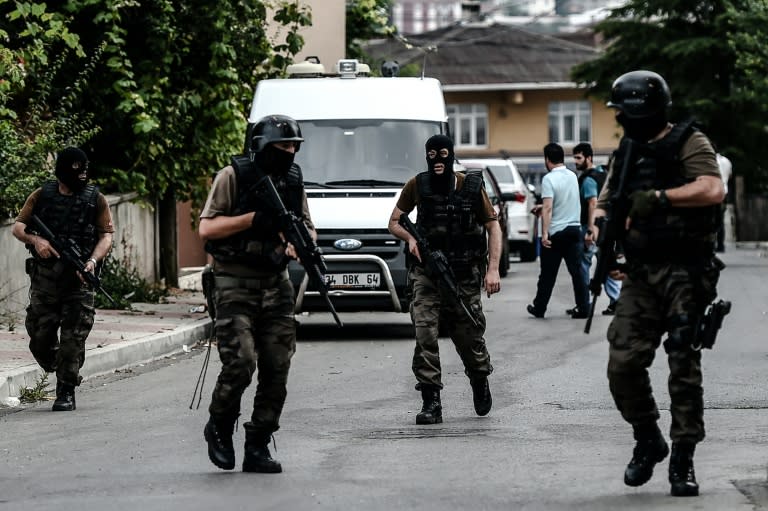 Turkish special police patrol the Sultanbeyli district in Istanbul after clashes with unidentified militants on August 10, 2015