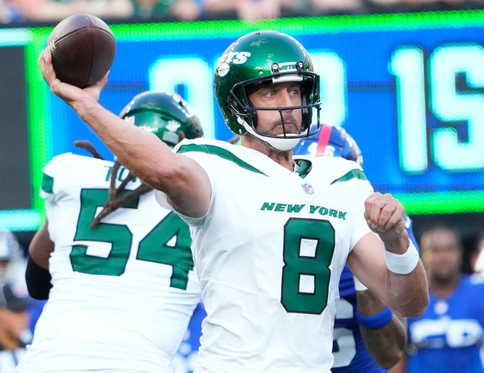 Jets quarterback Aaron Rodgers drops back for a pass against the Giants at MetLife Stadium in East Rutherford, New Jersey on Aug. 26, 2023.