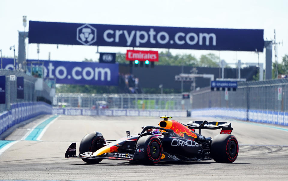 May 6, 2022; Miami Gardens, Florida, USA; Red Bull driver Sergio Perez of Mexico races into turn 1 through the circuit during qualifying for the Miami Grand Prix at Miami International Autodrome. Mandatory Credit: John David Mercer-USA TODAY Sports