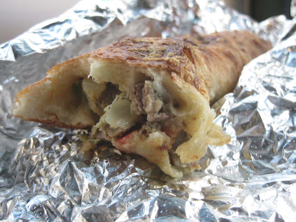 Close-up shot of a Costco Bake with bites taken out of it.