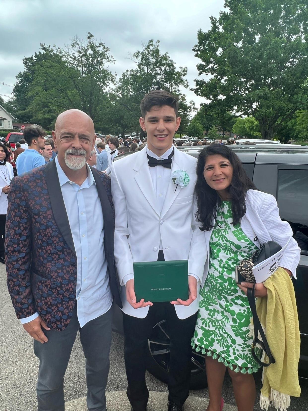Carl, Gus and Terri Paige at Gus's high school graduation. Gus is the Paige's seventh child.