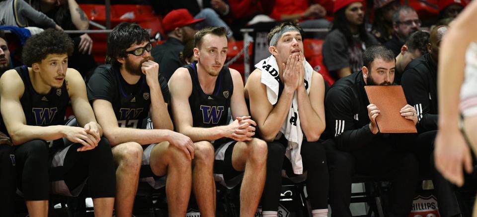 Washington Huskies players watch from the bench as Utah and Washington play at the Huntsman Center at the University of Utah in Salt Lake City on Sunday, Dec. 31, 2023. Utah battled back for a 95-90 win. | Scott G Winterton, Deseret News