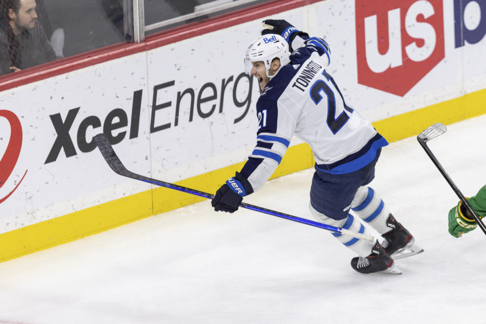 Winnipeg Jets center Dominic Toninato celebrates after scoring a goal during the third period of an NHL hockey game against the Minnesota Wild, Sunday, Dec. 31, 2023, in St. Paul, Minn. (AP Photo/Bailey Hillesheim)