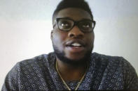 Miami Dolphins NFL football player Emmanuel Ogbah is shown during a Zoom news conference in this photo made in Miami Lakes, Fla., Thursday, March 26, 2020. The Miami Dolphins practiced safe distancing when they introduced eight newly acquired players hunkered down around the country, holding a series of news conferences via Zoom. The technology changed the dynamics of the conversation, and players seemed to like it. (AP Photo/Steve Wine)