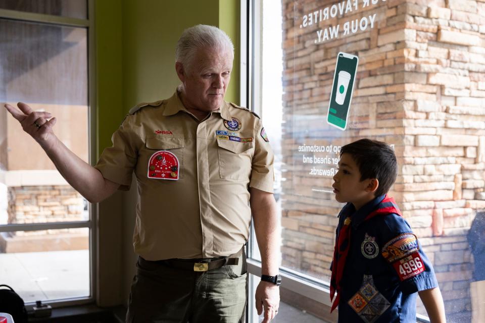 Val Parrish talks with Sebastian Augason of Troop 1996 during a food drive at Smith’s Grocery in West Valley City on Saturday, Feb. 10, 2024. | Marielle Scott, Deseret News