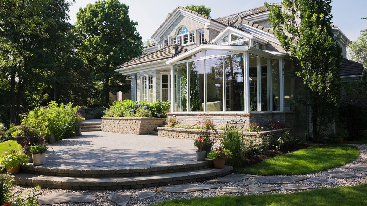  multi-level patio at rear of large house 