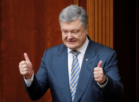 Ukrainian President Petro Poroshenko reacts during a session of parliament, after lawmakers supported his amendments to the constitution regarding the country's intentions to join the European Union and NATO, in Kiev, Ukraine February 7, 2019. REUTERS/Valentyn Ogirenko